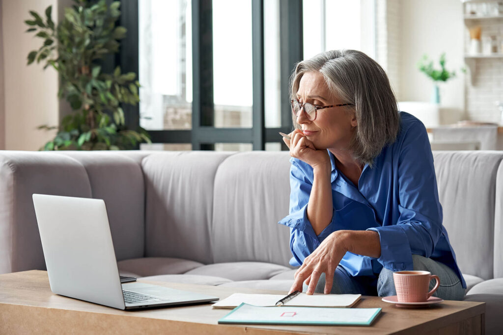 Older woman looking at a laptop